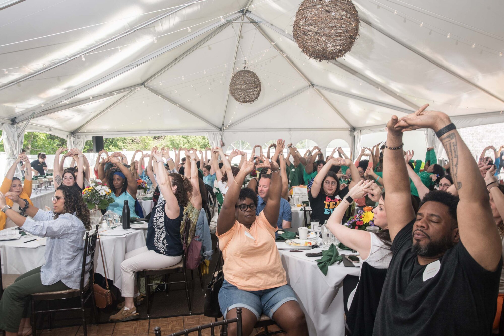 Staff participating in a stretching exercise 