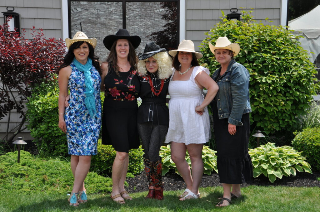 Group of attendees wearing cowboy hats