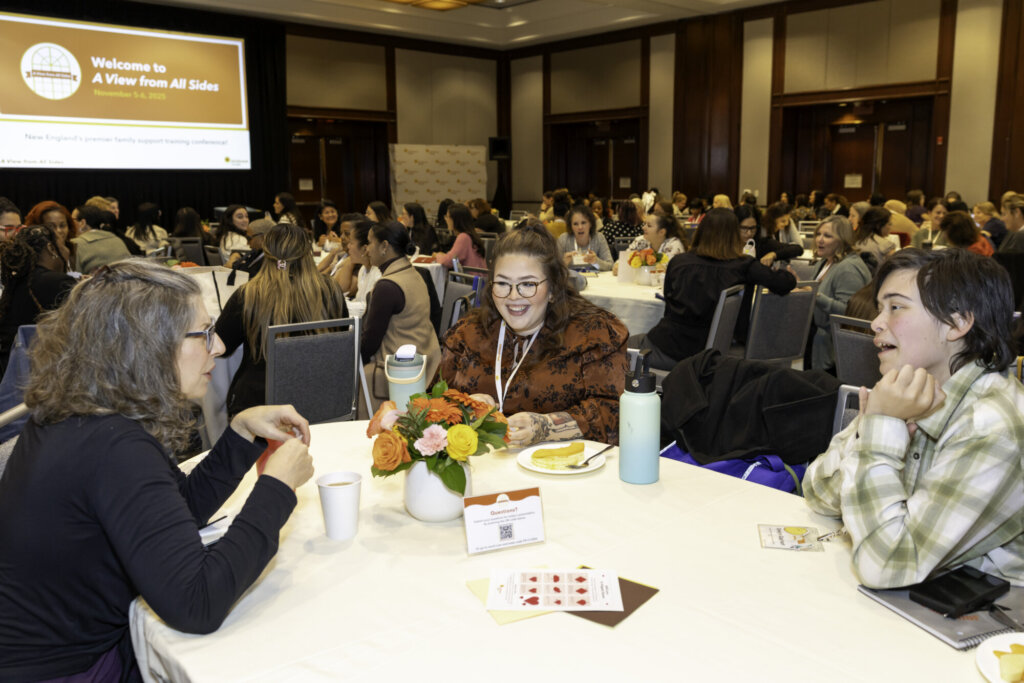 Table full of attendees talking with each other.