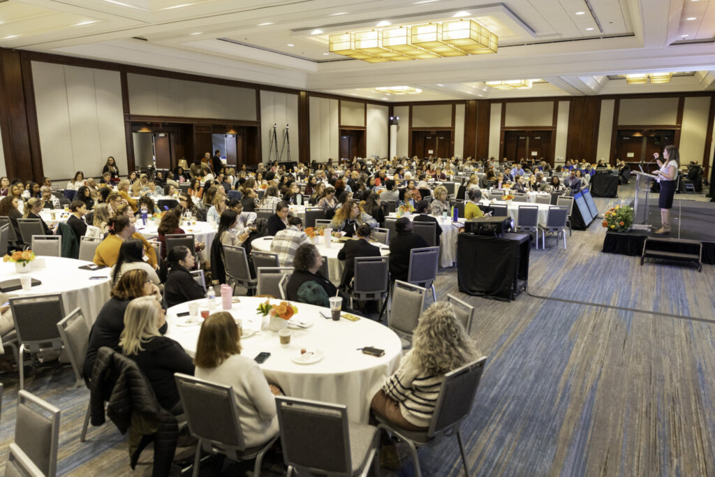 Full ballroom with attendees for A View from All Sides.