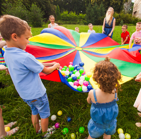 Kids playing with parachute