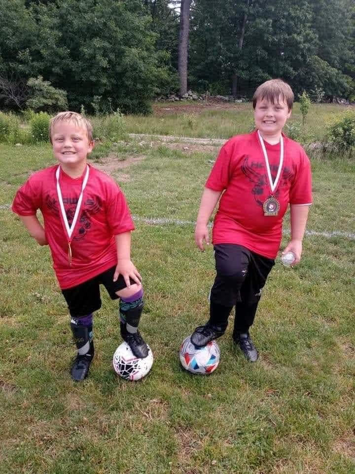Regina's sons, Julian and Jayden, in soccer uniforms.