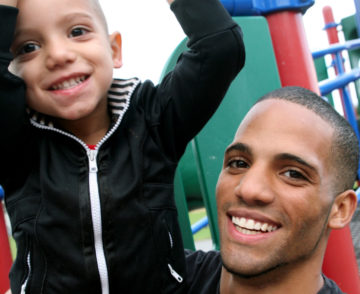 father and son smiling
