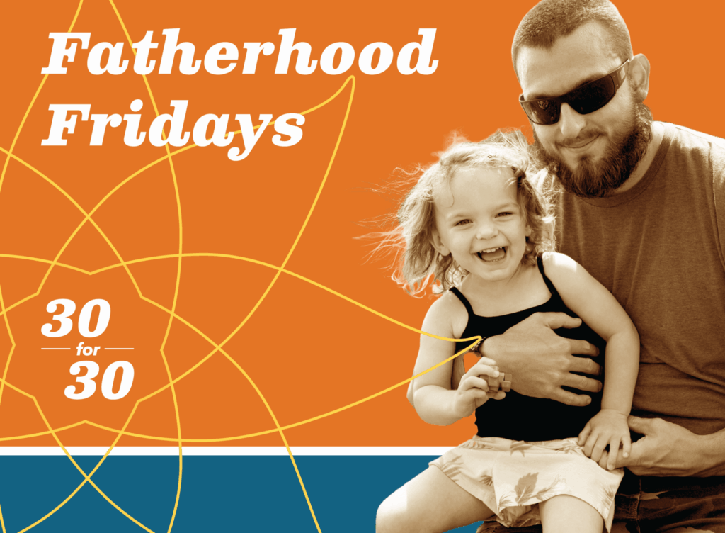 fatherhood fridays father holding little girl