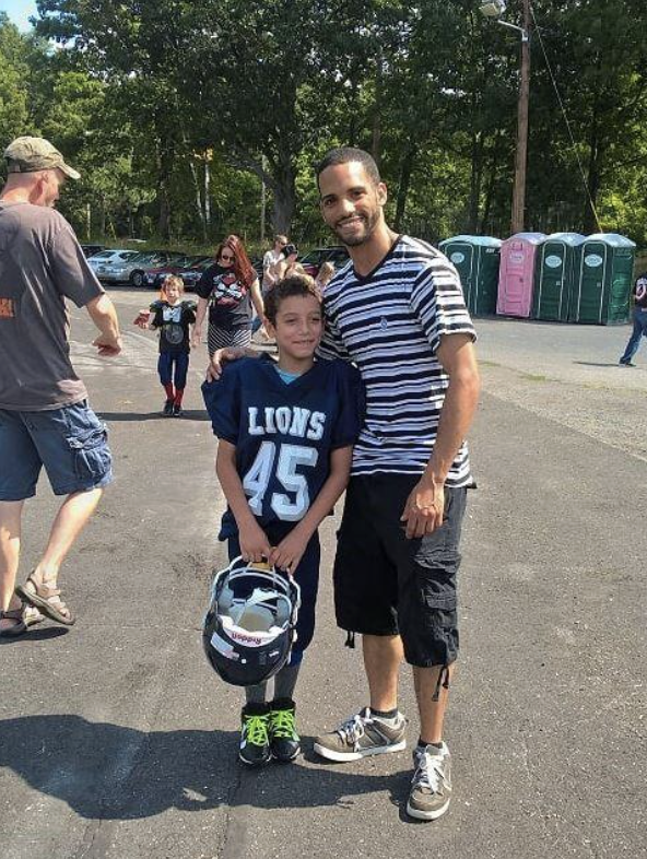 Norland with his son in football gear