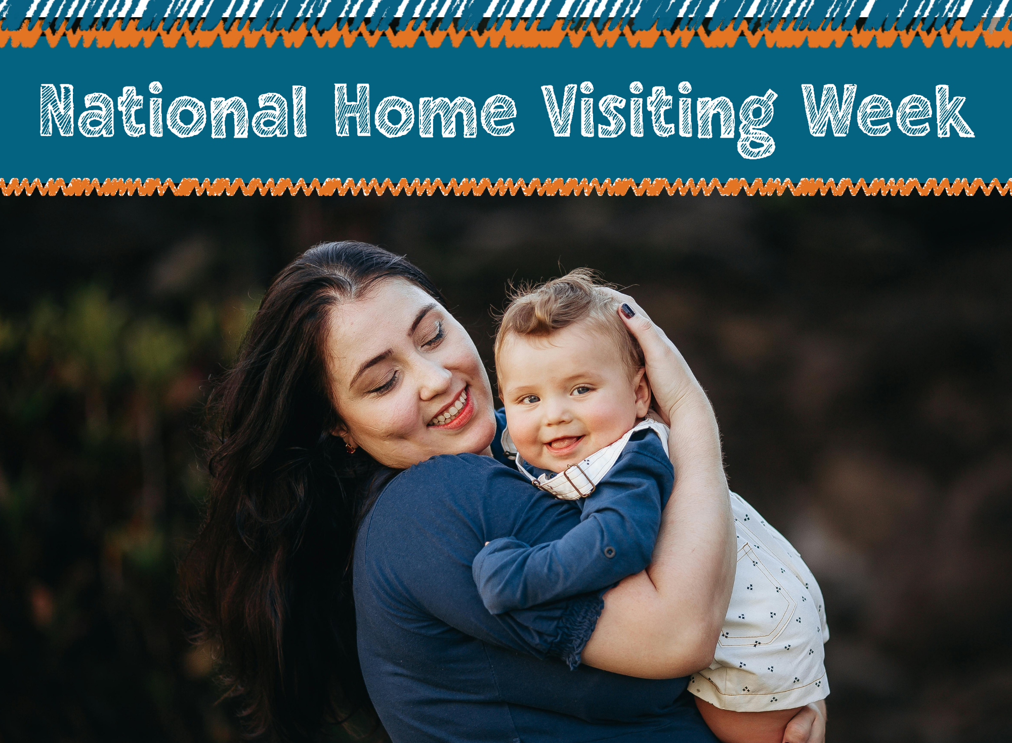 Mother holding baby smiling